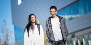 Two students walking to class together