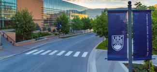 UBC street pole banners and UBC Okanagan campus in the background
